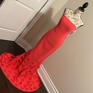 Beautiful strapless coral Prom or evening gown with flower appliqué